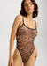 Mesh Leopard Bodysuit in blush with sheer stretch fabric and thin straps, designed for a soft, transparent fit in lingerie fashion.