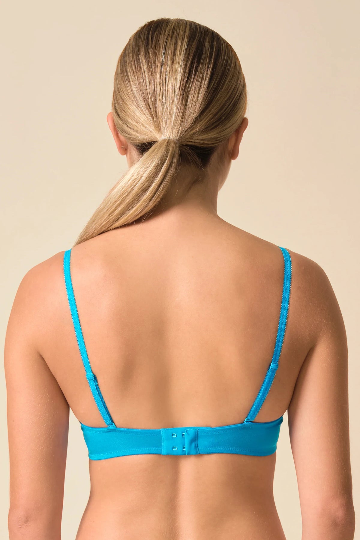 Back view of Gossard Glossies Sheer Bra Atomic Blue showing adjustable straps and hook-and-eye closure for invisible everyday support.