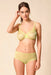 Model wearing Gossard Glossies Sunny Lime Sheer Bra and matching briefs, showcasing the lightweight, breathable lingerie set.