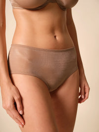 Beige lingerie set on a beige background