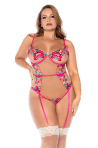 Plus-size model wearing Sheer Mesh Bodysuit Mapale Wild Flower with vibrant floral embroidery and sheer mesh panels, front view.