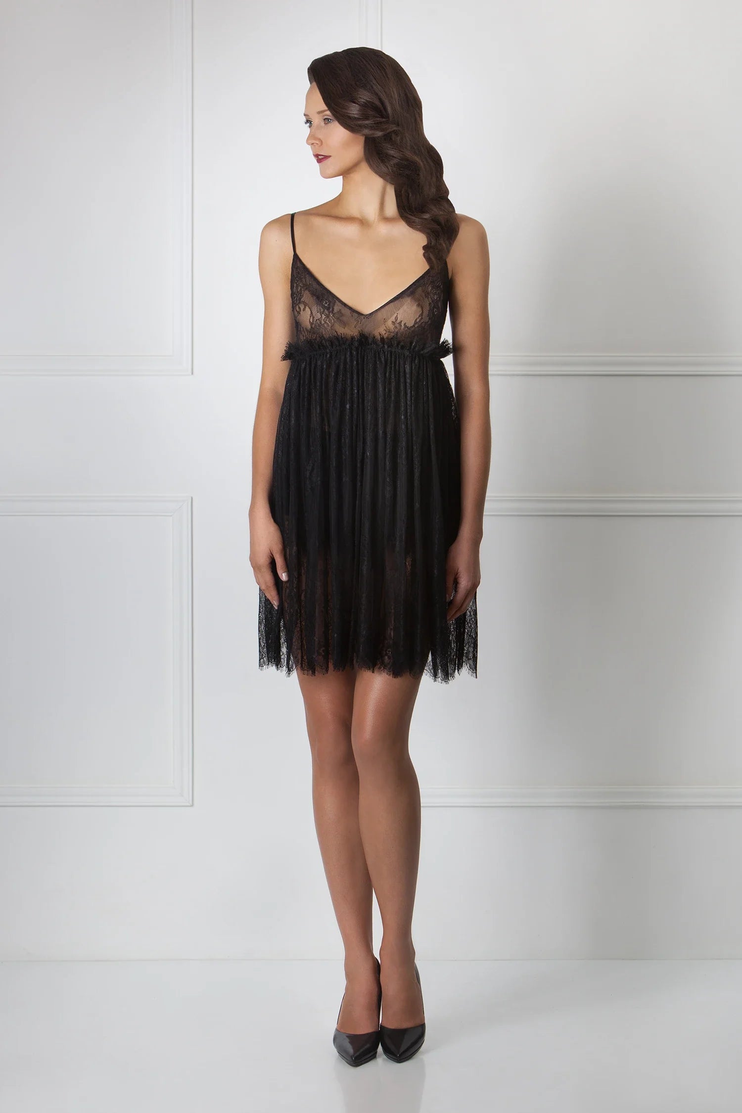 Luxurious black lace nightdress by Amoralle featuring a sheer lace bodice, pleated skirt, and delicate straps for romantic nightwear elegance.