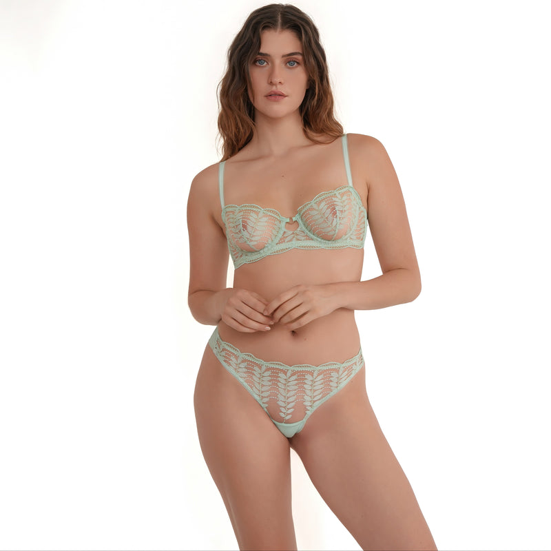 Front view of model in mint green lace tanga panties with intricate embroidery and scalloped edges, perfect for everyday wear.