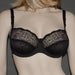 Front view of Conturelle Plus Size Bra in black with sheer lace detailing, designed for comfort, elegance, and natural shaping in larger cup sizes.