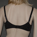 Back view of Conturelle Sheer Lace Plus Size Bra in black, featuring adjustable straps and secure hook-and-eye closure for optimal fit and support.