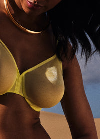 Close-up of Gossard Glossies Sunny Lime Sheer Bra highlighting the sheer mesh fabric and seamless molded cup detail.