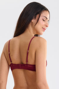Close-up of lace detail on Garnet Red underwire bra with adjustable straps