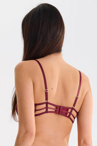 Back view of Garnet Red lace open cup bra with adjustable straps and gold hardware