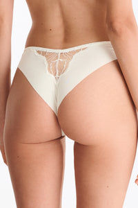 Close-up of ivory lace Brazilian panty with floral embroidery and high-leg silhouette