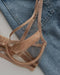 Flat lay of Kinga Nude Demi Cup Bra Lou on denim background, showing fine mesh details and soft fabric for stylish lingerie appeal.