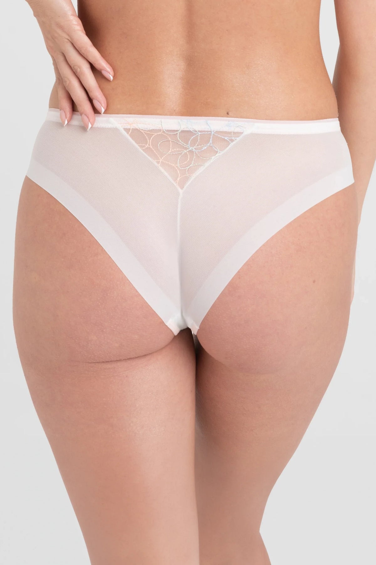 Back view of Low-Rise Mesh Brazilian Tanga Panty Samanta Fiorella M300 shows semi-sheer mesh with embroidered detail, offering a flattering fit.