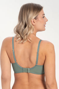 Side profile of woman wearing green lace plunge bra