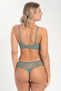 Full figure woman in green lace plunge bra, side view