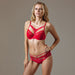 Full front view of model wearing Lauma Rouge Peek-A-Boo Bikini Panty and matching red bra, highlighting sexy and elegant lingerie set.