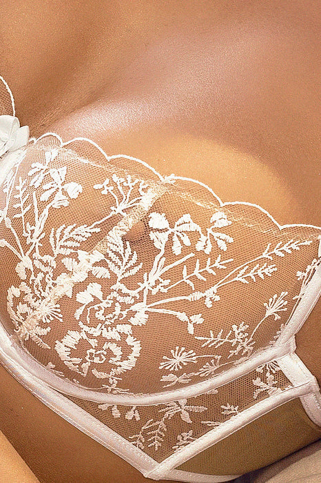 Detailed close-up of embroidered floral lace on Axami Enigma White Sheer Mesh Balconette Bra, showcasing its delicate craftsmanship.
