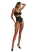 Full-body view of model in Crotchless Teddy with Bold Cutouts Hersis, showing off high-leg cut and strappy lace design from the front.