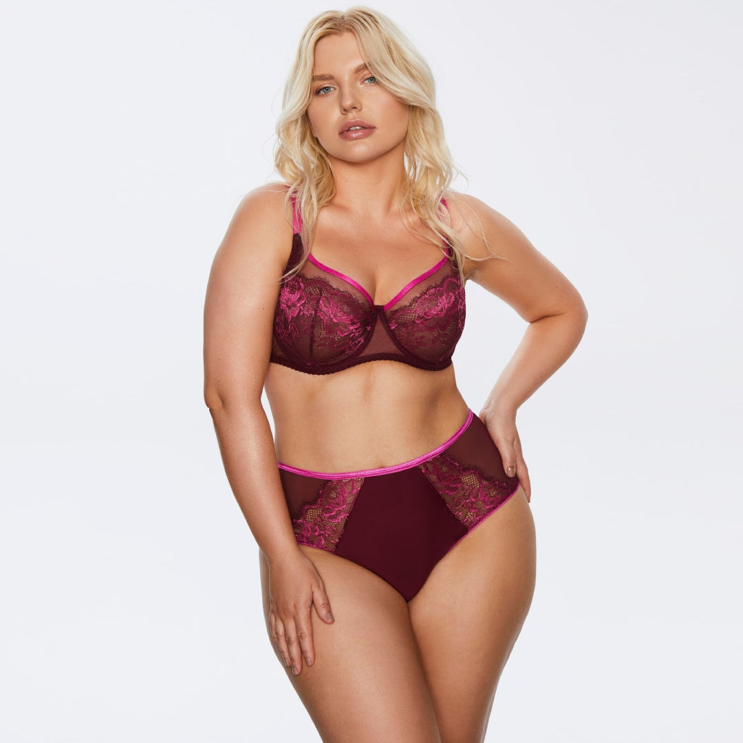Model wearing Sheer Mesh Full Figure Lace Bra Kinga Love Promise with matching high-waist lace panties in Bordeaux and pink.
