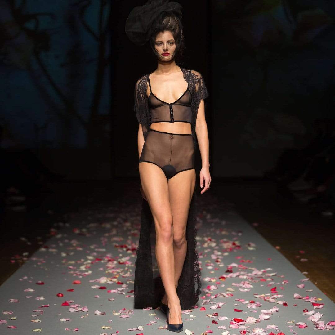 Model wearing the Amoralle Sheer Mesh Lingerie Set on the runway with lace robe and heels. High-fashion presentation of luxury 2pc lingerie set.